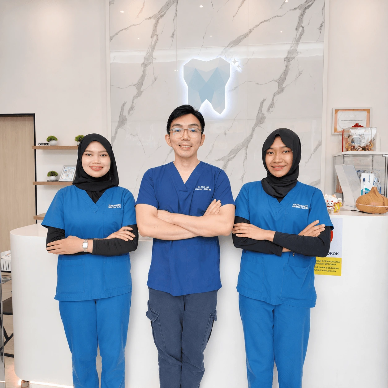Full-length portrait of the Tooth Buddy Dental Clinic Semenyih dental team