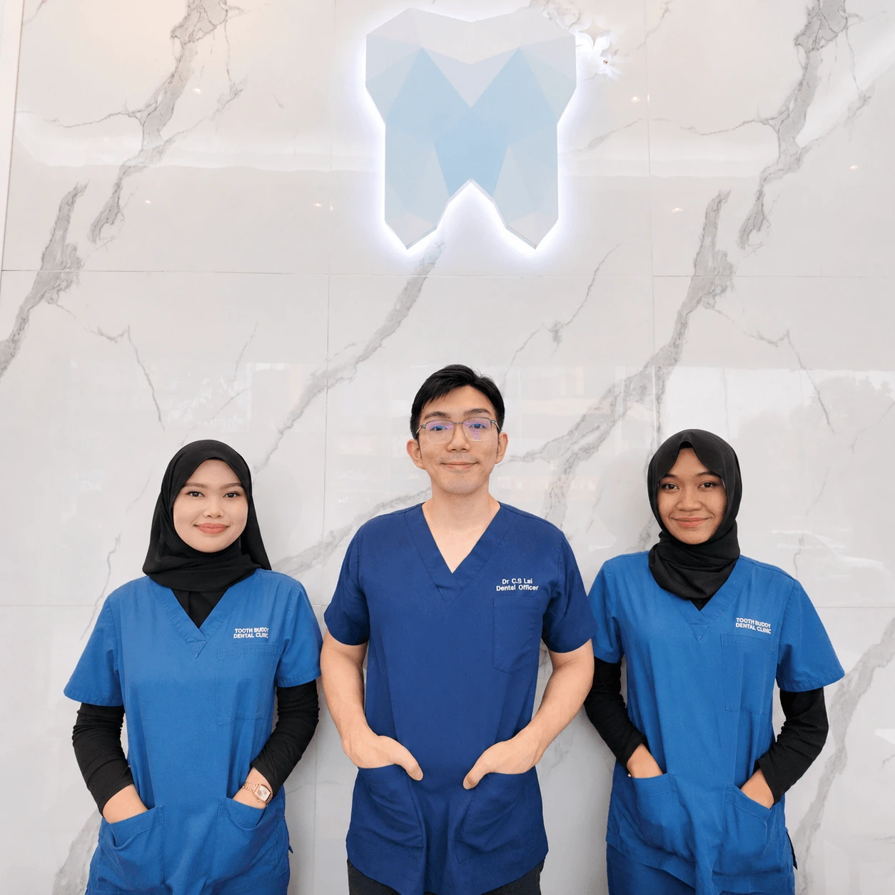 Tooth Buddy Dental Clinic Semenyih team portrait in clinical uniforms