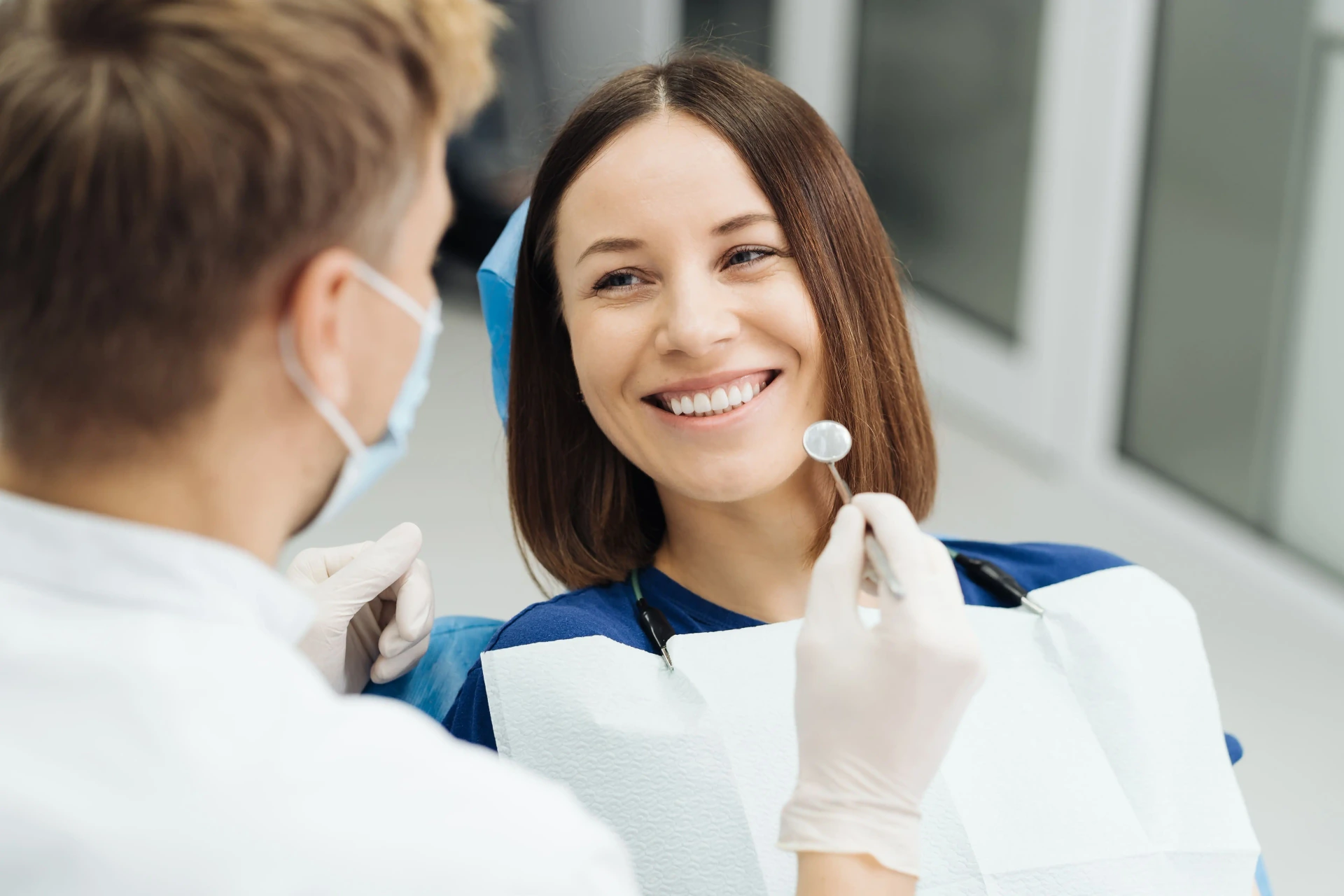 Patient smiling during a cosmetic dental smile makeover consultation